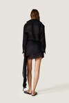 Black loose dress with an asymmetric cut and flowing side detail